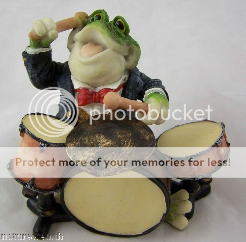 This Drum playing frog is handcrafted and hand painted. He is made of 