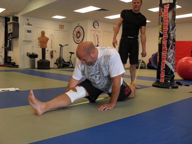 Yoga students at Third Law Yoga, MMA, BJJ work on splits in a yoga class at 8 a.m. Thursday mornings in the Naples, Florida gym Yoga students at Third Law Yoga, MMA, BJJ work on splits in a yoga class at 8 a.m. Thursday mornings in the Naples, Florida gym